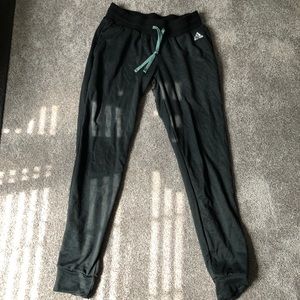 Reebok green and black sweatpants.